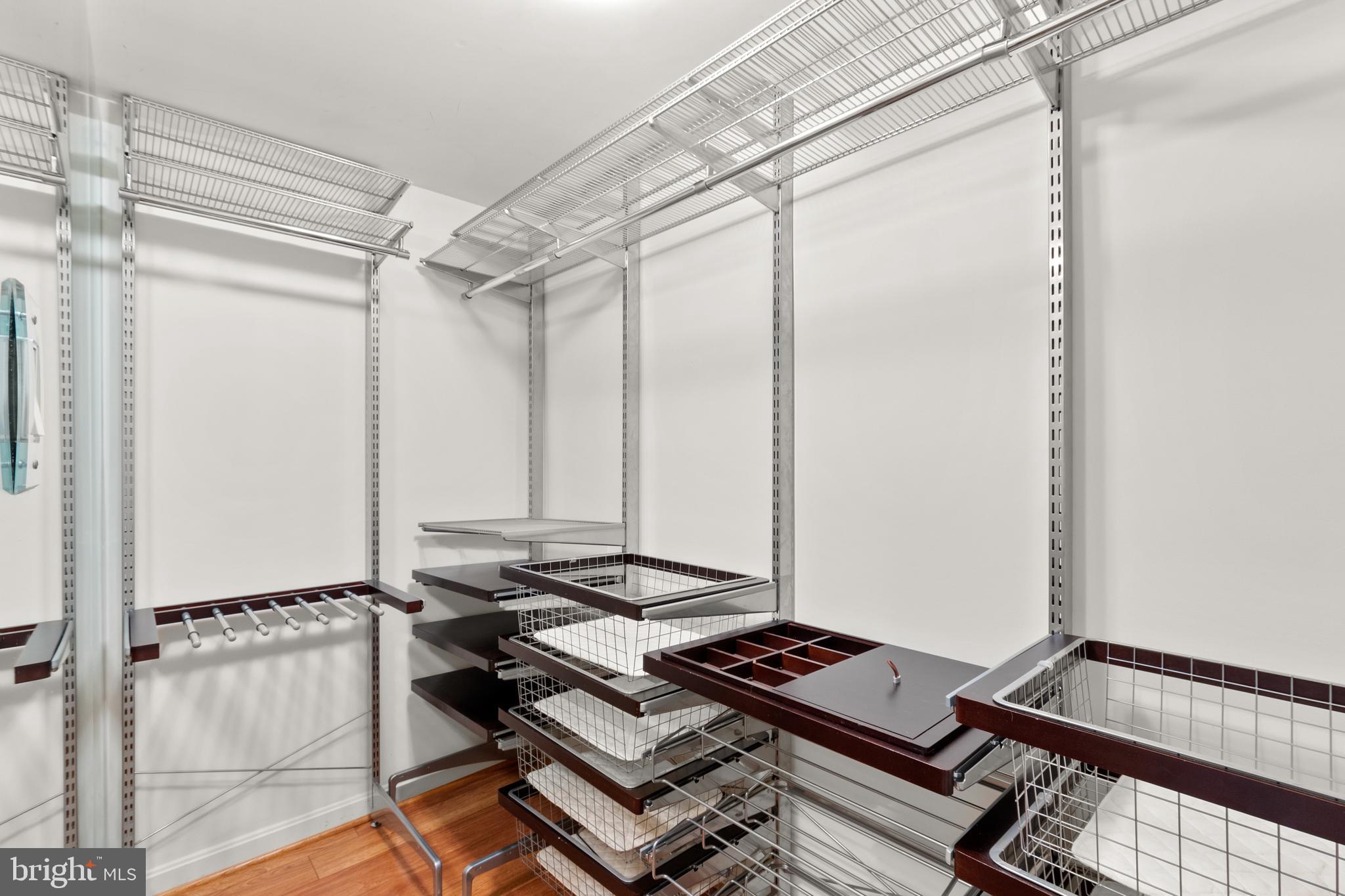 1911 Belmont Road Northwest, Unit 71 Washington, DC 20009 - Photo 14 of 22 Large walk-in closet with custom Elfa shelving and