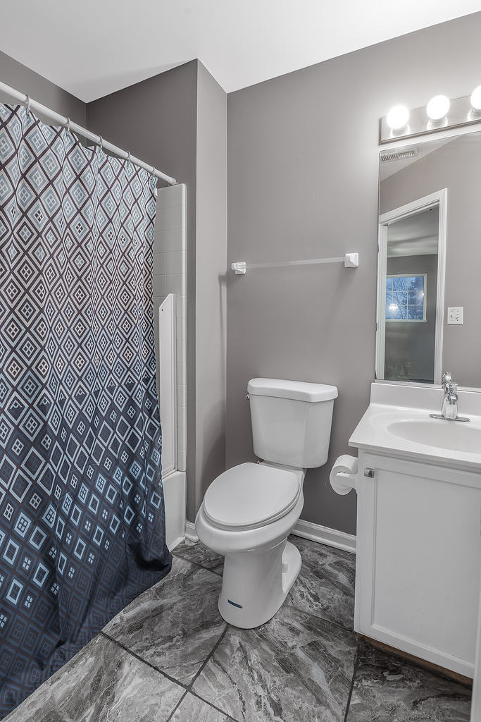 2452 Daybreak Court, Unit 2452 Elgin, IL 60123 - Photo 12 of 22 a bathroom with a toilet and a sink