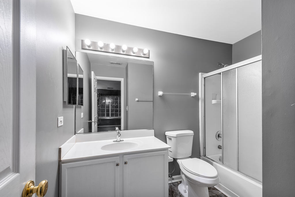 2452 Daybreak Court, Unit 2452 Elgin, IL 60123 - Photo 14 of 22 a bathroom with a toilet a sink and mirror