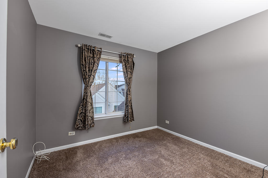 2452 Daybreak Court, Unit 2452 Elgin, IL 60123 - Photo 15 of 22 a view of an empty room and window