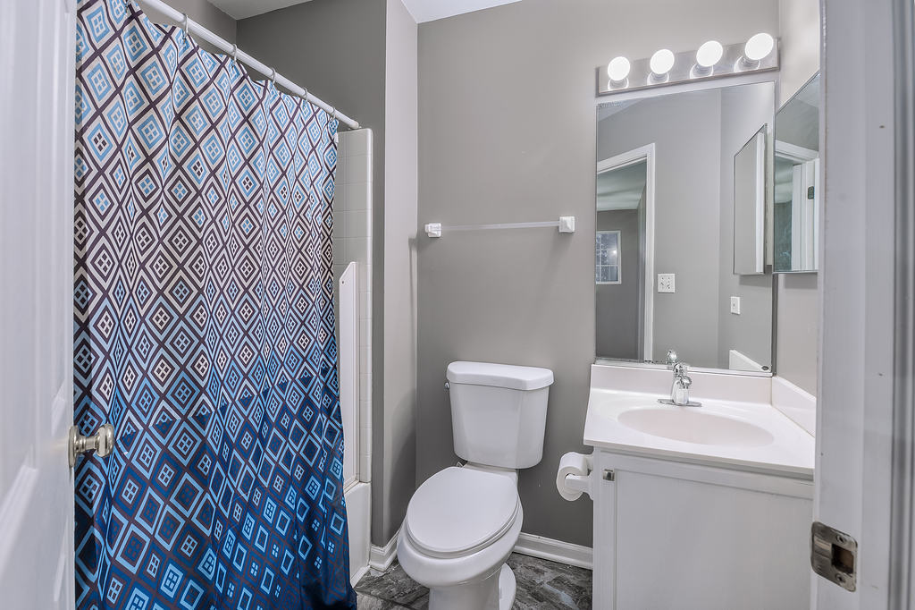 2452 Daybreak Court, Unit 2452 Elgin, IL 60123 - Photo 16 of 22 a white toilet sitting next to a bathroom sink