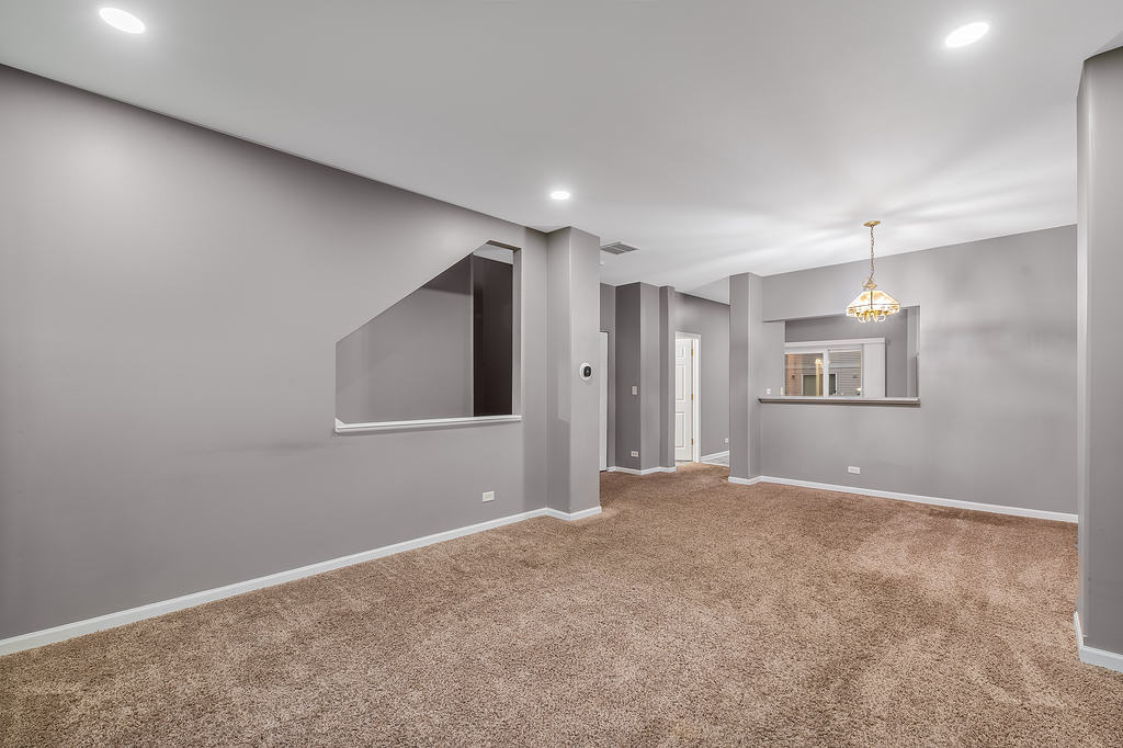 2452 Daybreak Court, Unit 2452 Elgin, IL 60123 - Photo 20 of 22 a view of an empty room with a window