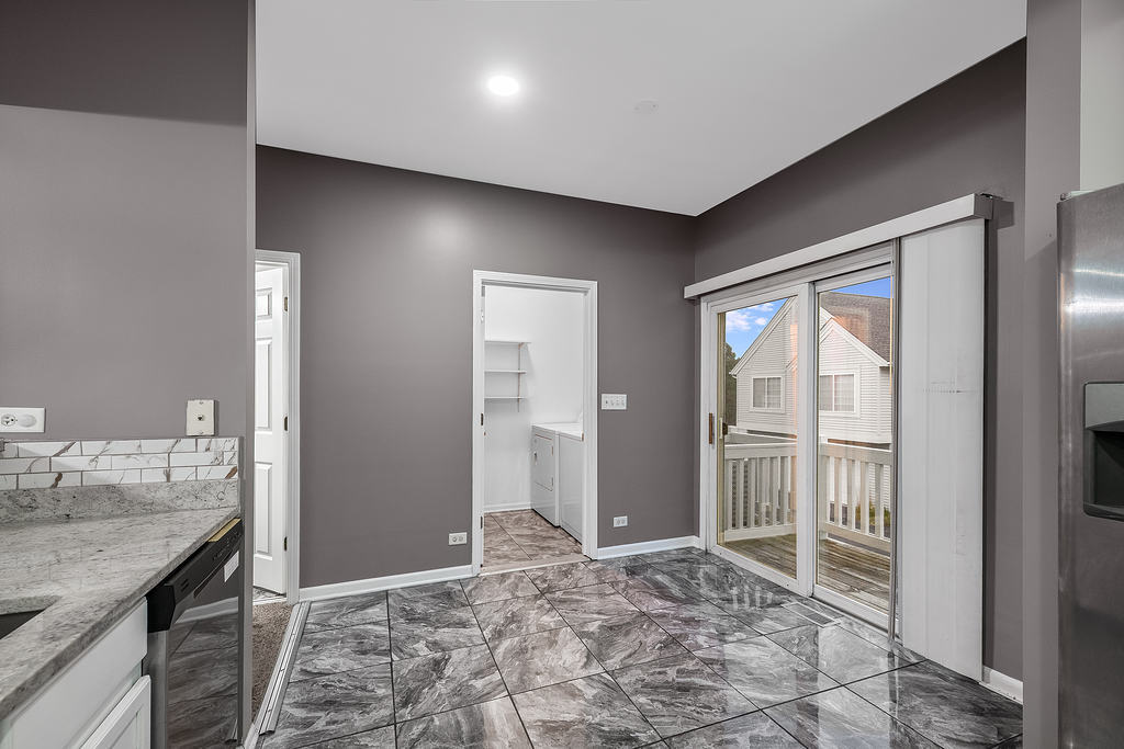 2452 Daybreak Court, Unit 2452 Elgin, IL 60123 - Photo 3 of 22 a view of a bathroom with a sink and a vanity