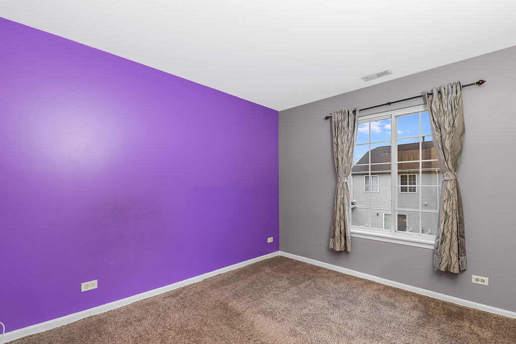 2452 Daybreak Court, Unit 2452 Elgin, IL 60123 - Photo 7 of 22 an empty room with windows