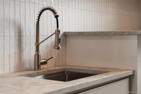 a view of an empty room and a window