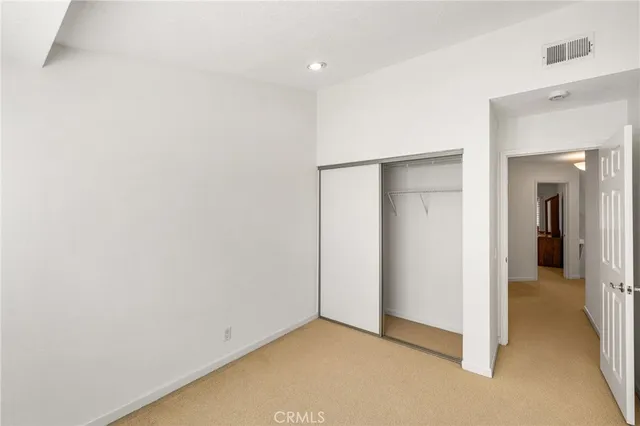 a bathroom with a toilet a sink and a mirror