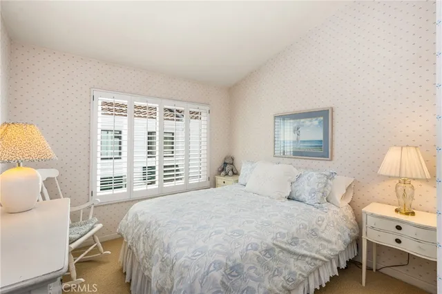 a bedroom with a bed and a walk in closet