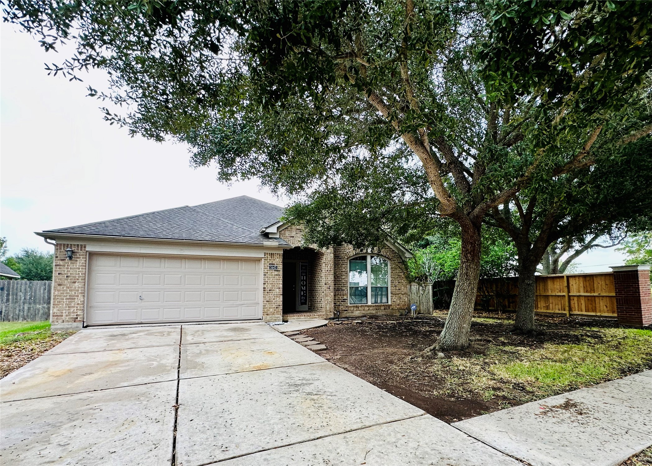 5643 Walnut Glen Lane Rosenberg, TX 77471 - Photo 2 of 35 a front view of a house with a yard and garage