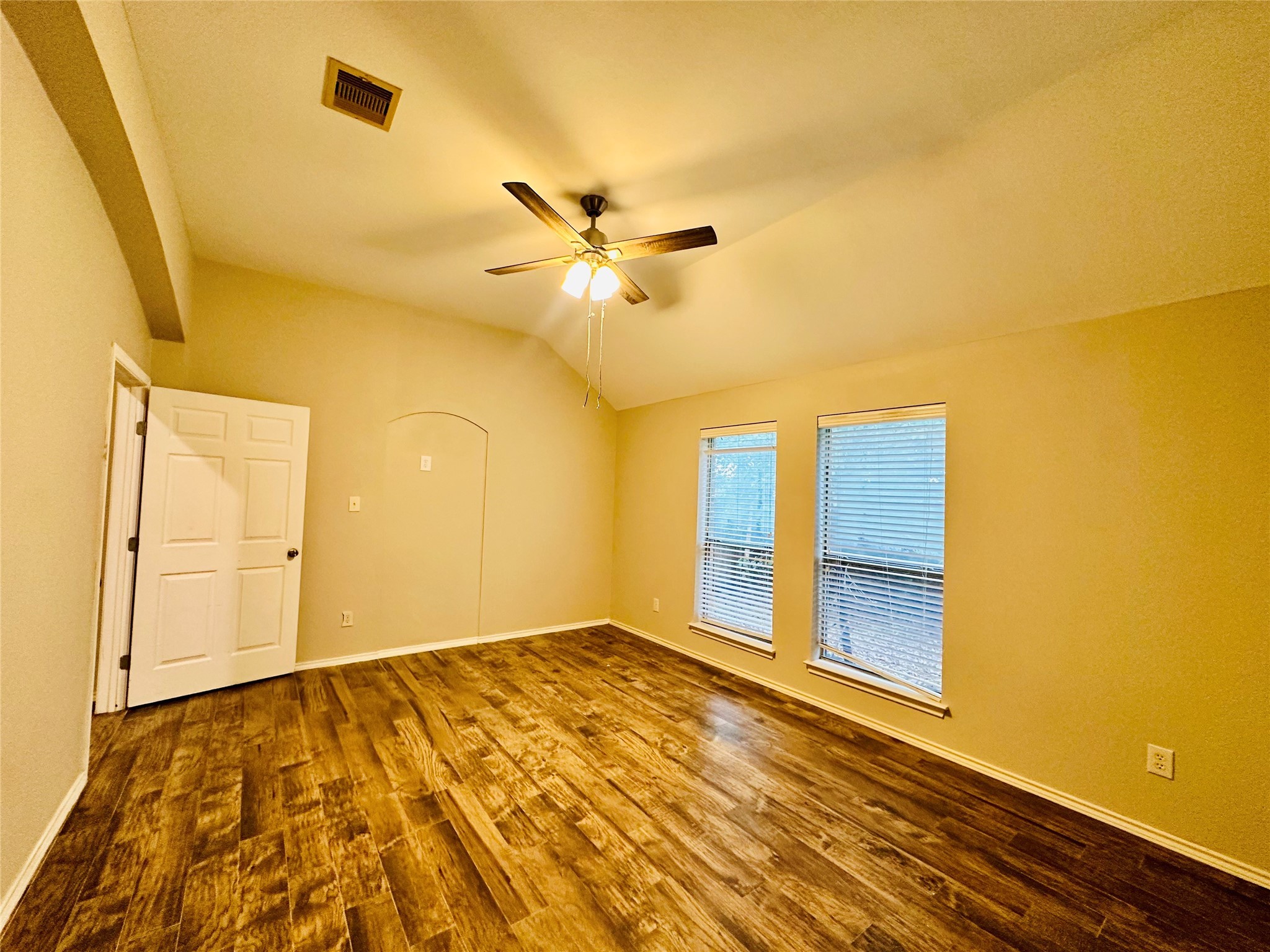 5643 Walnut Glen Lane Rosenberg, TX 77471 - Photo 32 of 35 a view of a big room with wooden floor and a ceiling fan