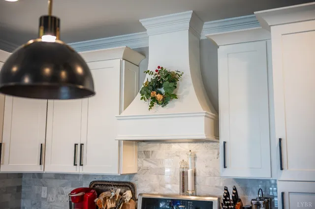 a bathroom with a sink vanity mirror and toilet