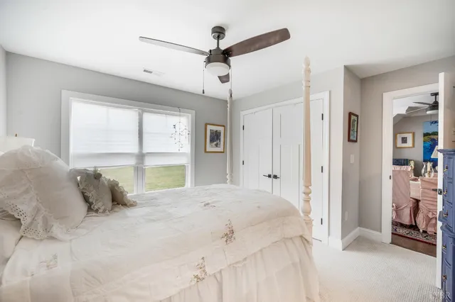 a view of a house with swimming pool and a yard