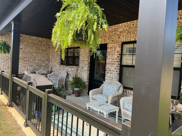 a front view of a house with outdoor seating