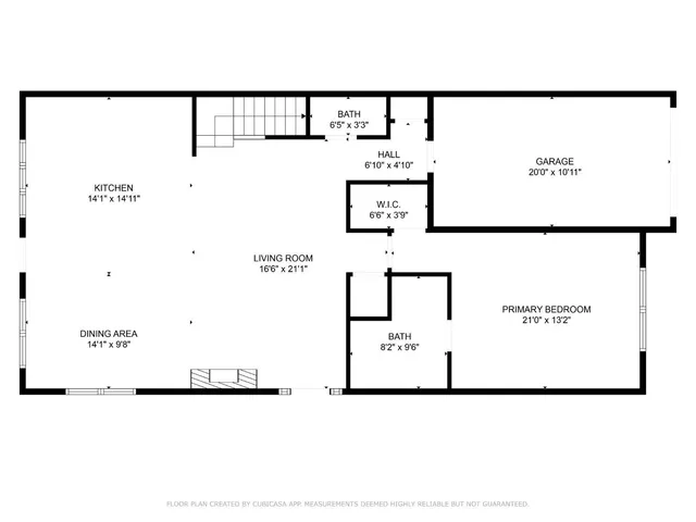 a living room with furniture a rug and kitchen view