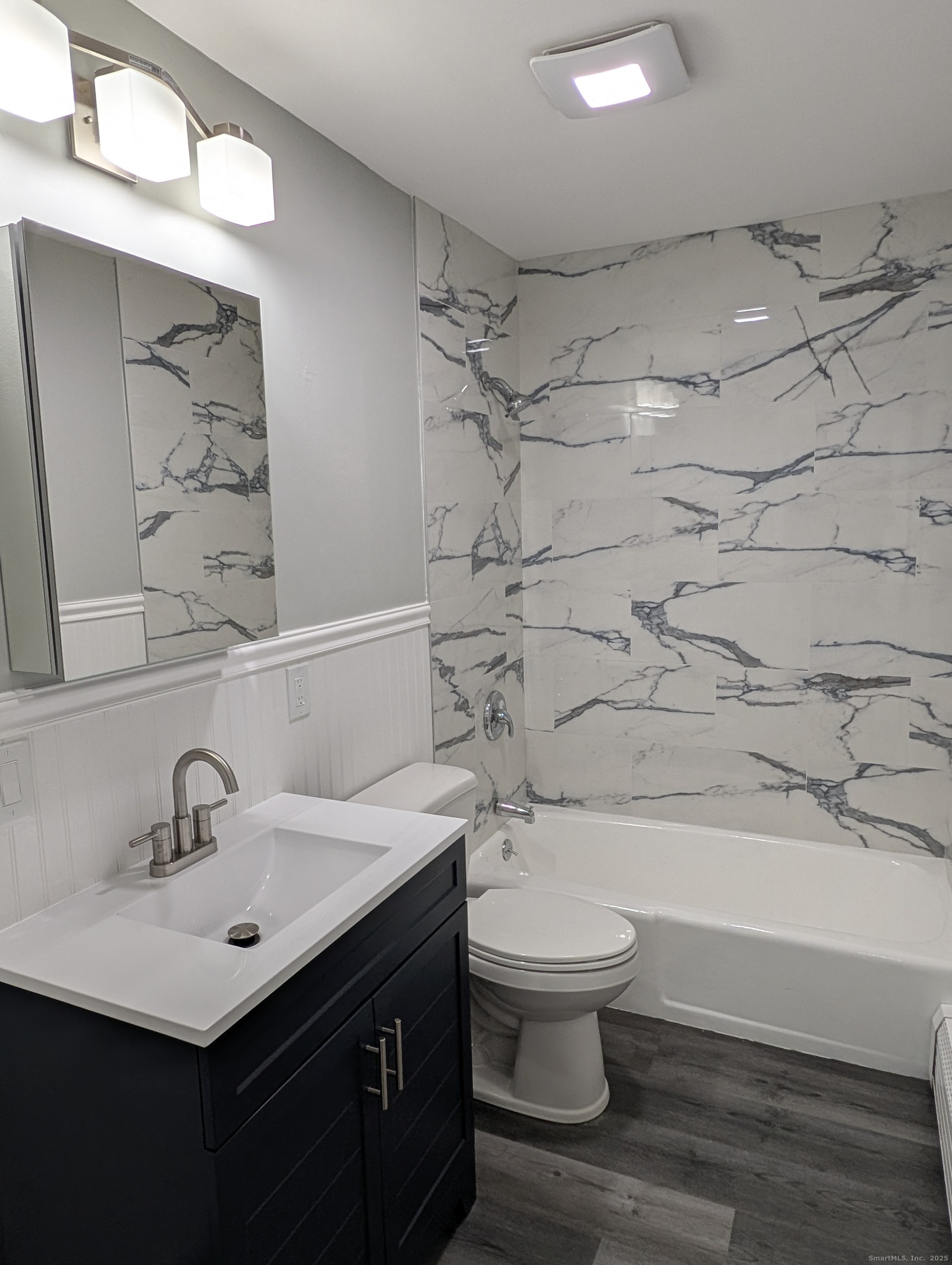 161 West Spring Street, Unit B2 West Haven, CT 06516 - Photo 6 of 17 a bathroom with a sink toilet and shower