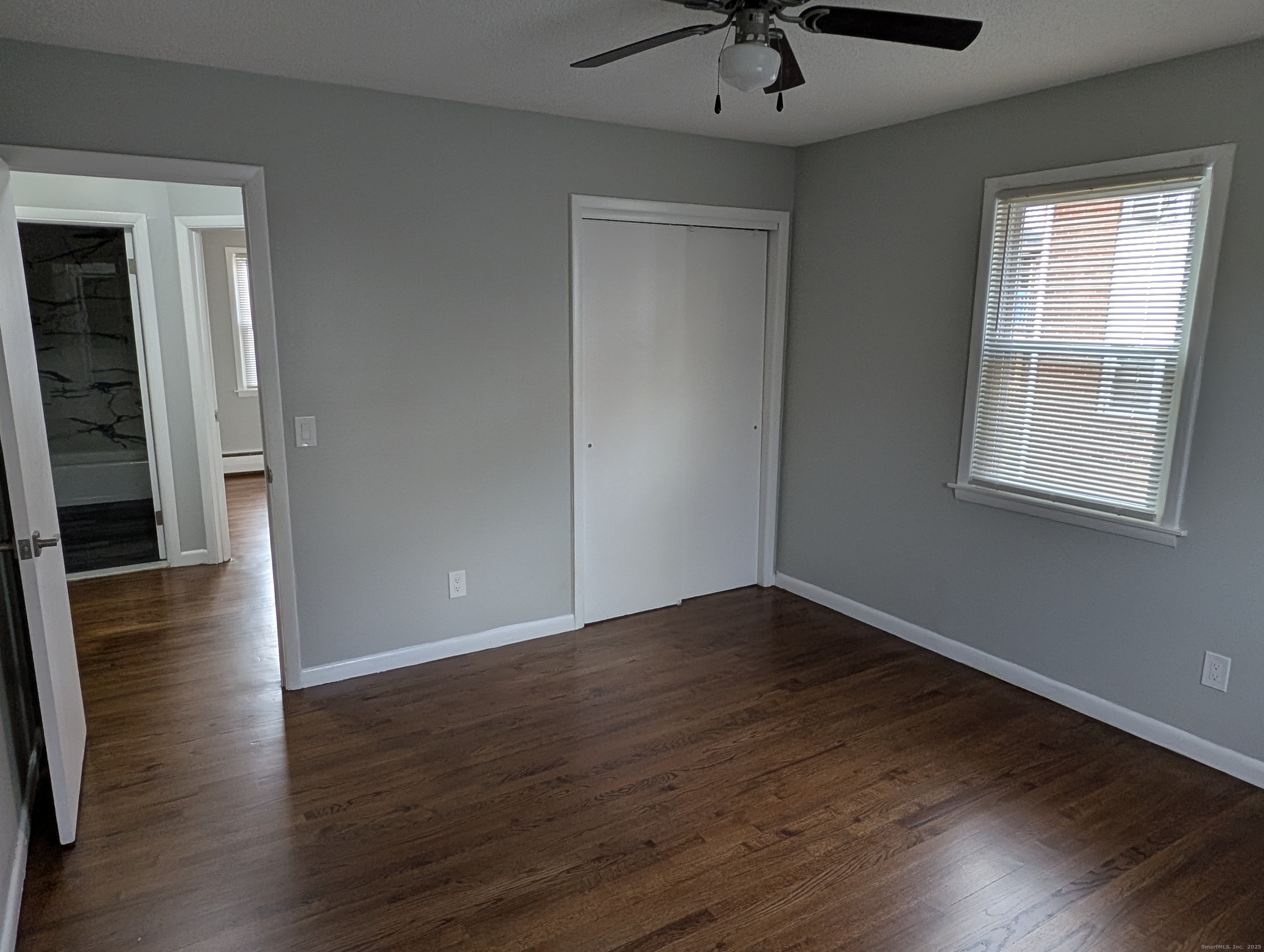 161 West Spring Street, Unit B2 West Haven, CT 06516 - Photo 10 of 17 wooden floor in an empty room with a window