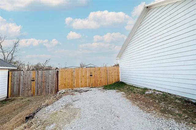 a view of a small space in front of a house