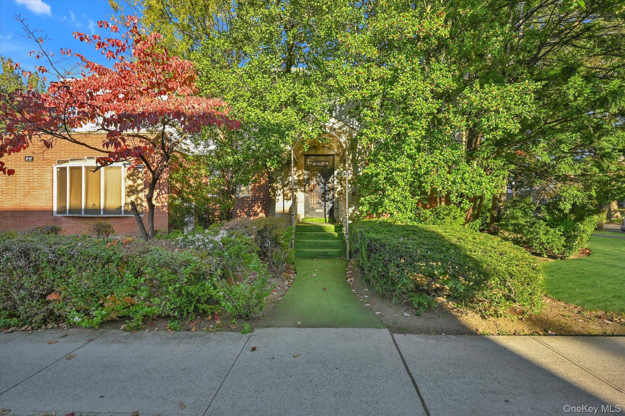 147-01 70th Avenue Queens, NY 11367 - Photo 1 of 21 a backyard of a house with lots of green space