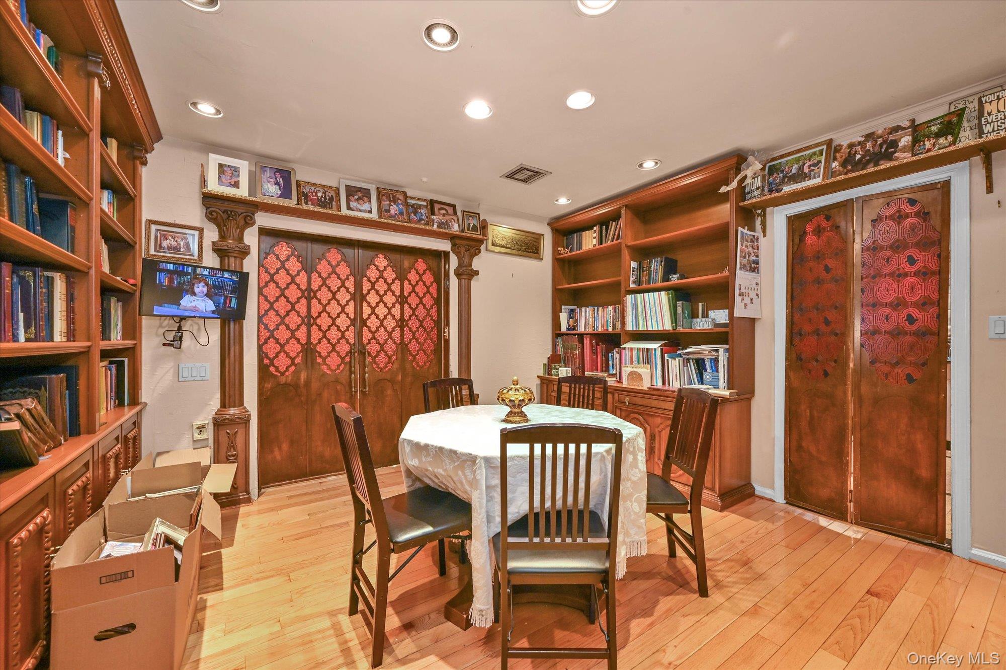 147-01 70th Avenue Queens, NY 11367 - Photo 13 of 21 a dining room with furniture and a book shelf