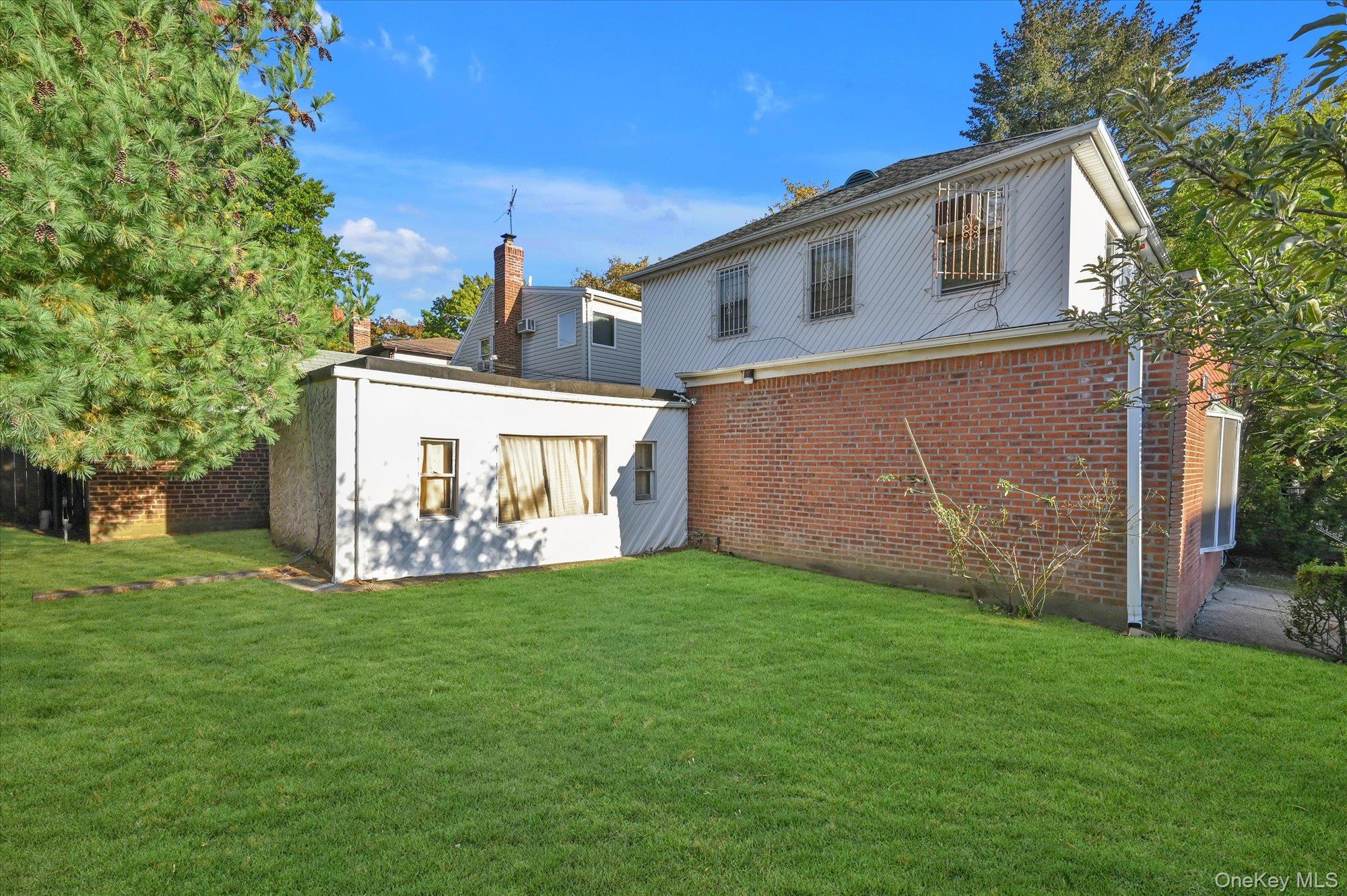 147-01 70th Avenue Queens, NY 11367 - Photo 3 of 21 a view of a house with a yard