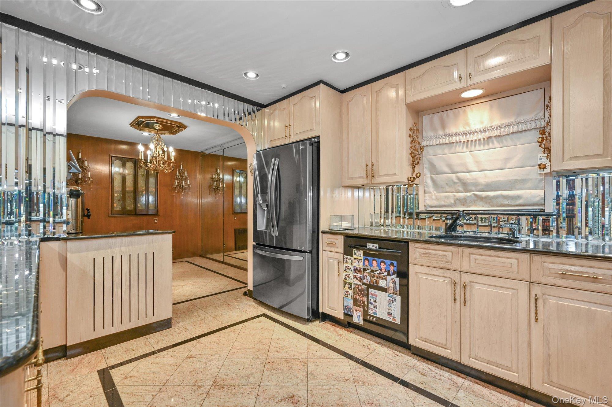147-01 70th Avenue Queens, NY 11367 - Photo 4 of 21 a kitchen with stainless steel appliances granite countertop a refrigerator and a sink