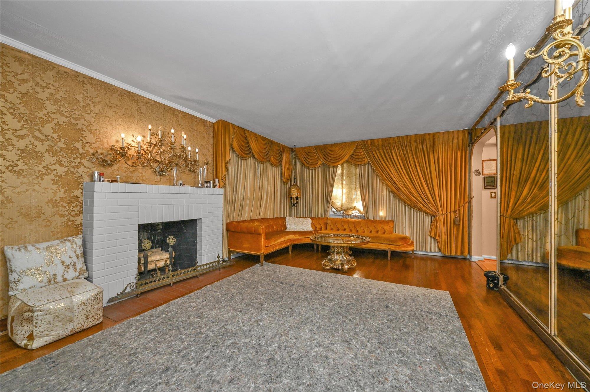 147-01 70th Avenue Queens, NY 11367 - Photo 7 of 21 a living room with a fireplace furniture and a large window
