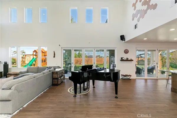 a kitchen with stainless steel appliances granite countertop wooden cabinets and a counter top space