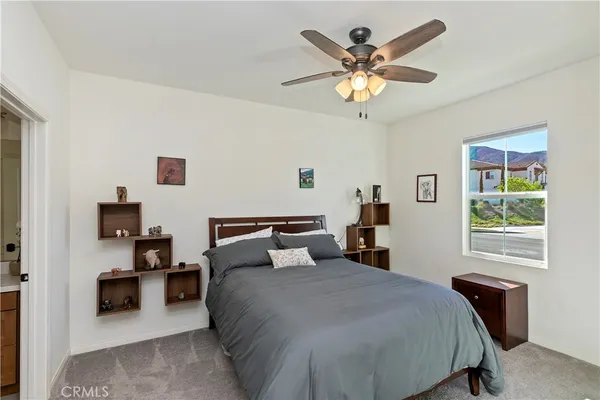 a bedroom with a bed and a fireplace