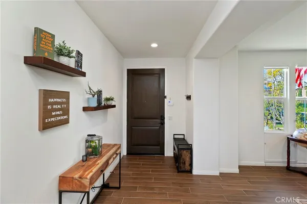 a living room with furniture a window and a fireplace
