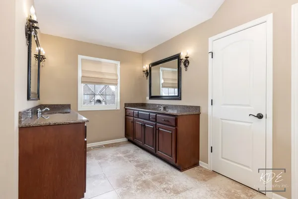 a kitchen with stainless steel appliances granite countertop a stove and a refrigerator