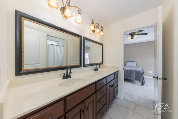 a bathroom with a sink a vanity and a mirror