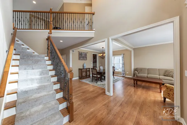 a view of a livingroom with furniture and hardwood floor