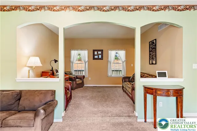 a living room with furniture and a couch