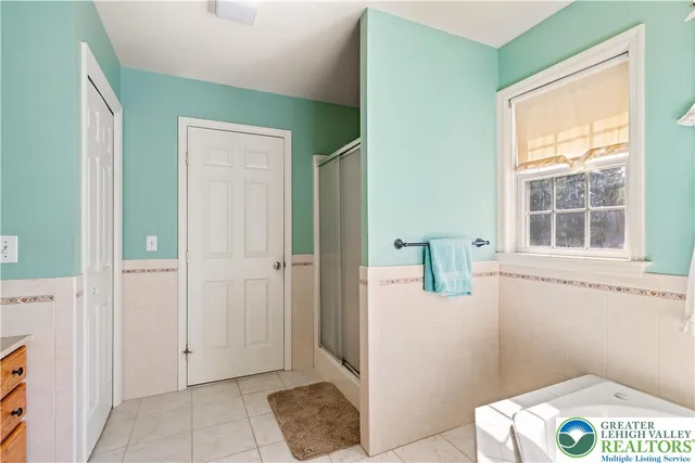 a view of hallway with window and cabinet