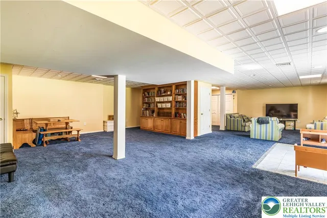 a view of a livingroom with furniture and a flat screen tv