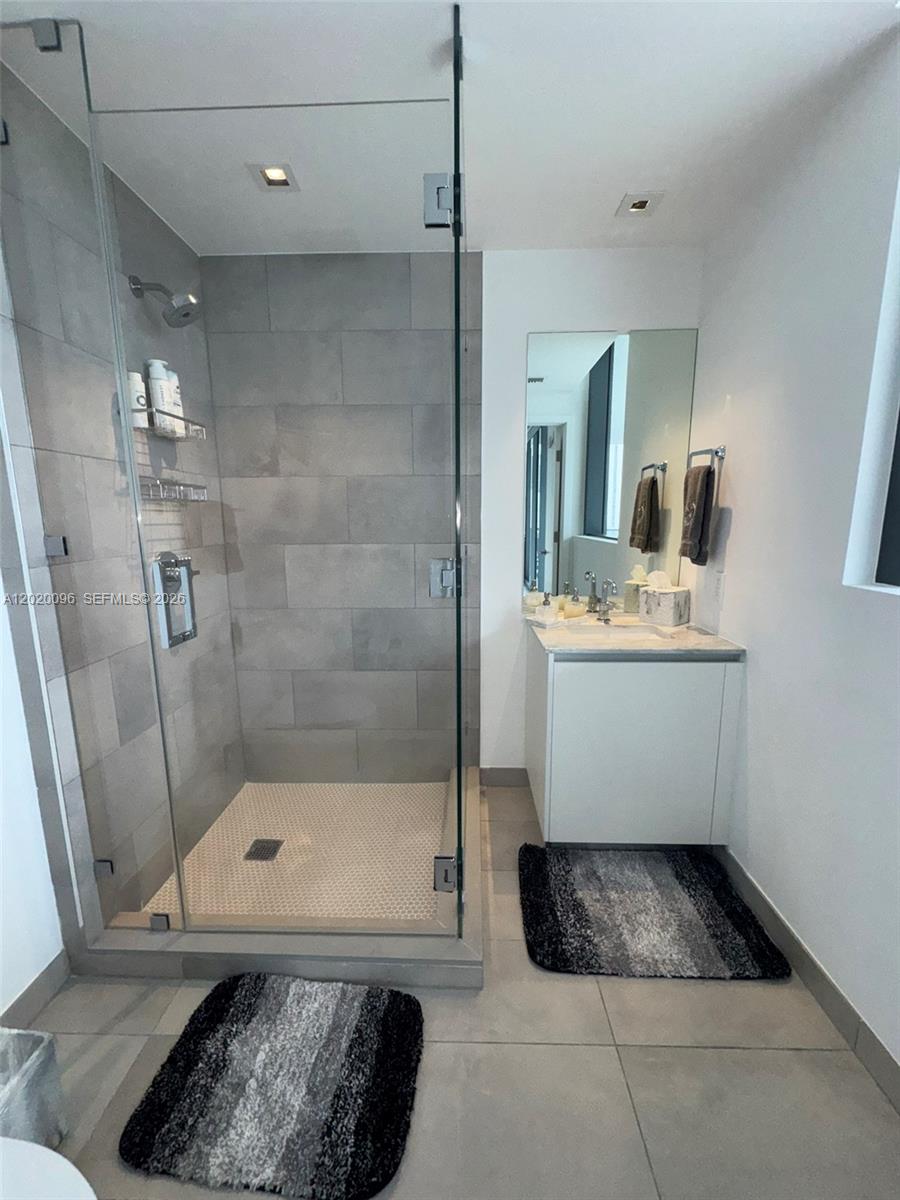 788 Northeast 23rd Street, Unit 1202 Miami, FL 33137 - Photo 36 of 64 a bathroom with a sink a toilet and shower