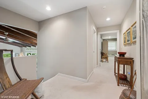 a view of a livingroom with furniture and a window
