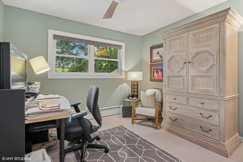 a workspace with furniture and window