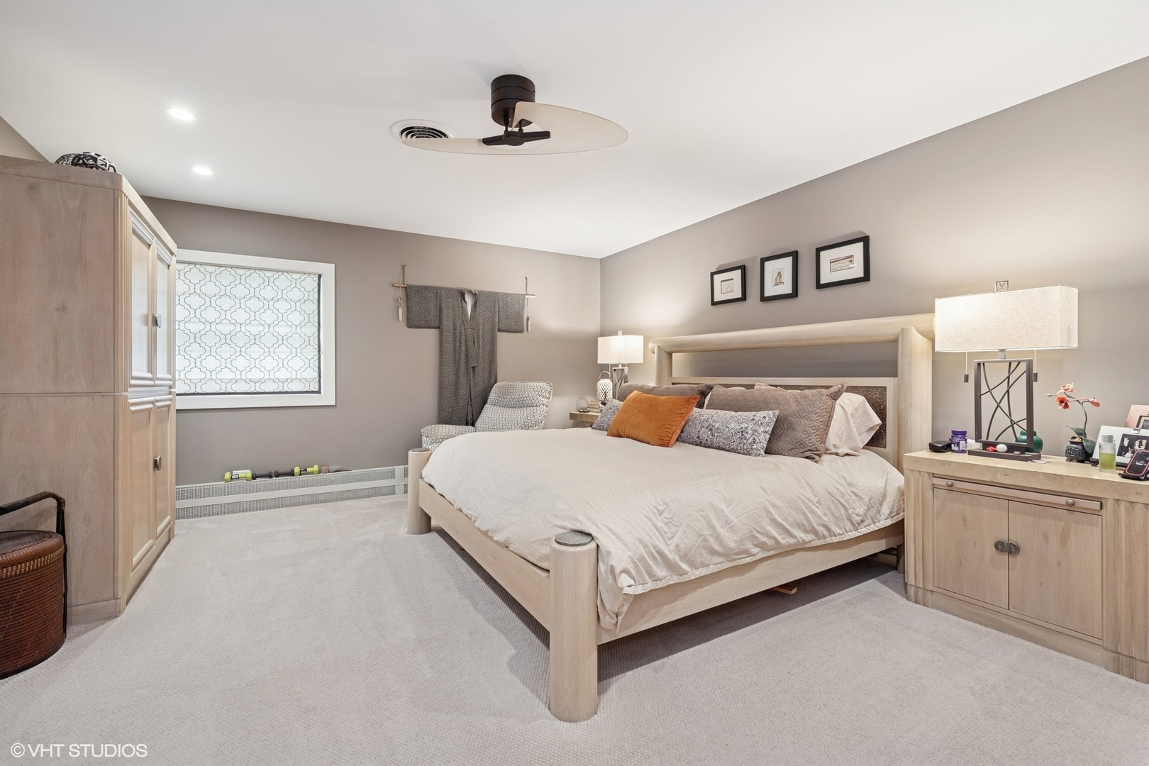 180 A Old Sutton Road Barrington Hills, IL 60010 - Photo 18 of 30 a spacious bedroom with a bed and a chandelier