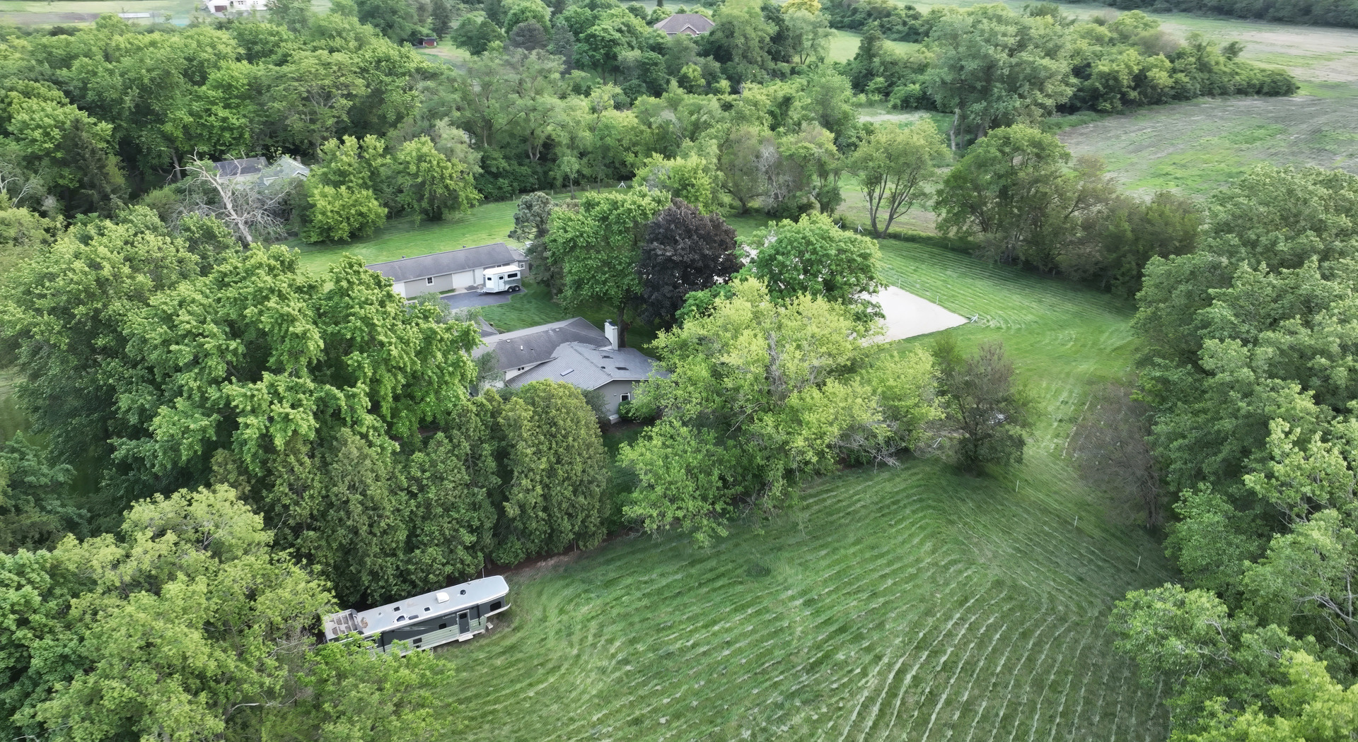 180 A Old Sutton Road Barrington Hills, IL 60010 - Photo 2 of 30 an aerial view of residential house with outdoor space and trees all around