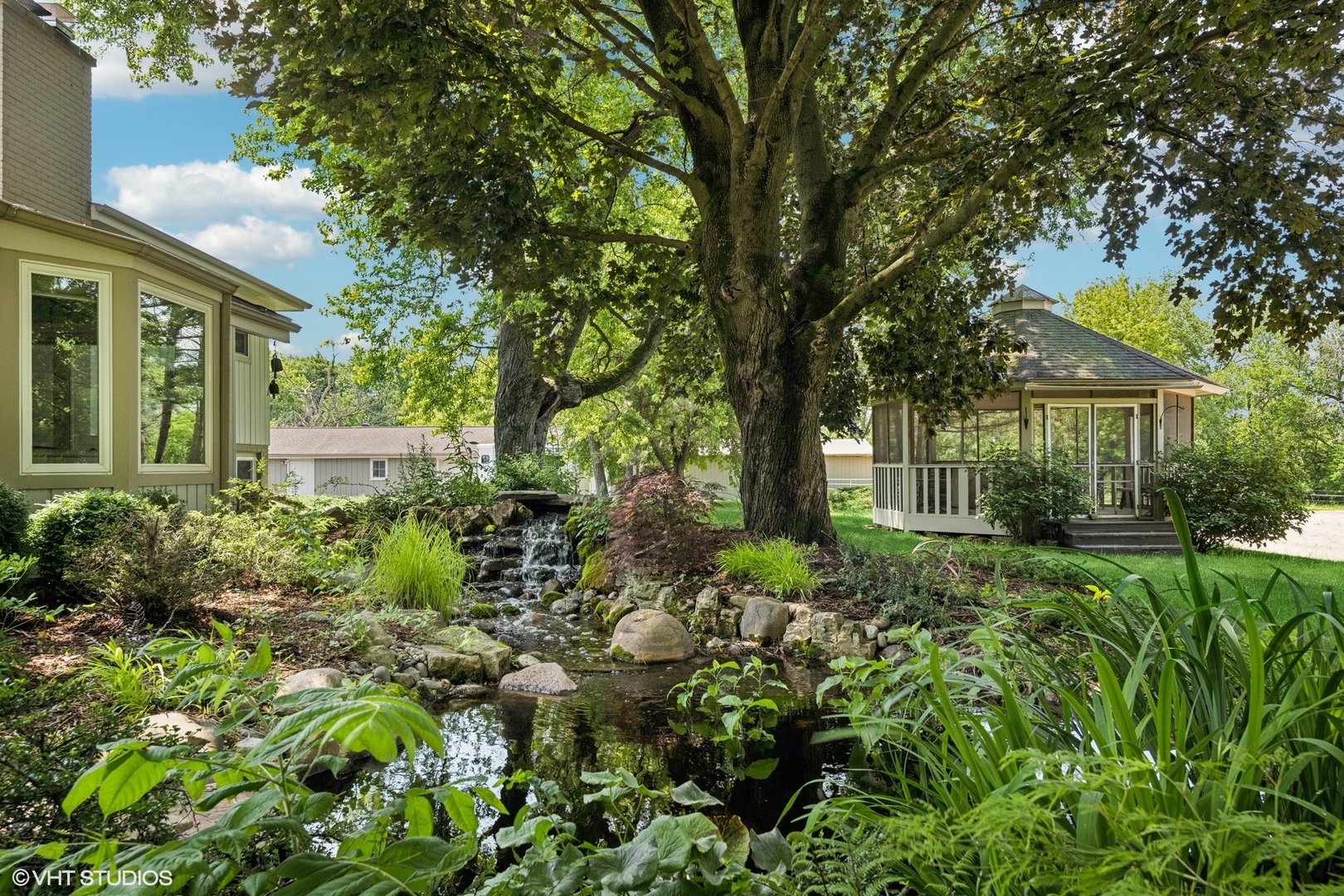 180 A Old Sutton Road Barrington Hills, IL 60010 - Photo 27 of 30 front view of a house with a yard