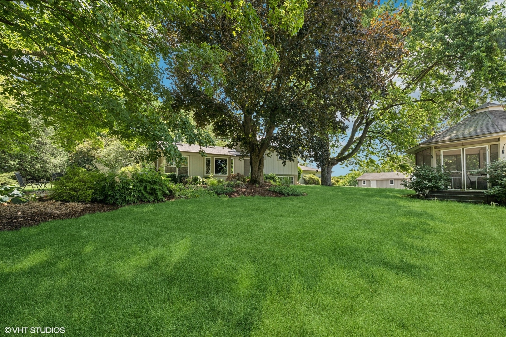 180 A Old Sutton Road Barrington Hills, IL 60010 - Photo 29 of 30 a view of an house with backyard space and garden