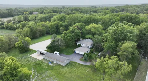 an aerial view of a house with yard