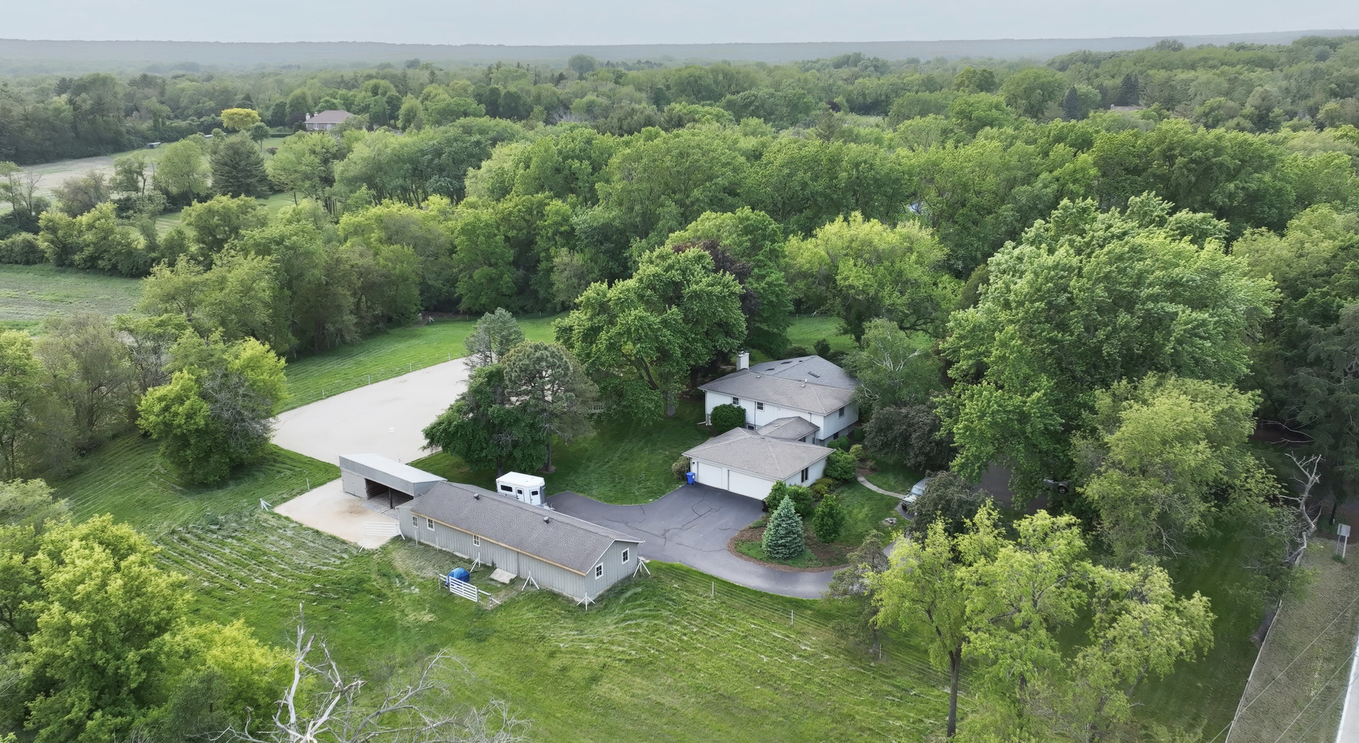 180 A Old Sutton Road Barrington Hills, IL 60010 - Photo 3 of 30 an aerial view of a house with yard