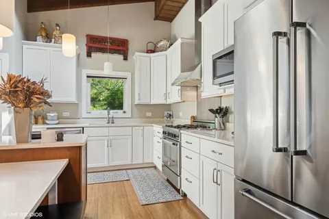 a kitchen with a sink stove and refrigerator