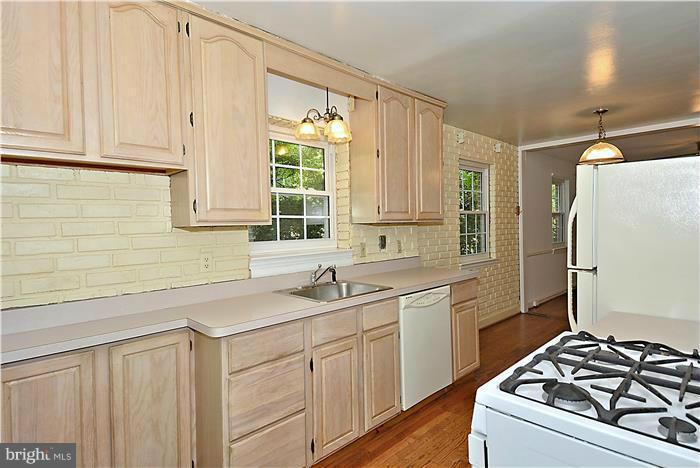 2808 Ivydale Street Silver Spring, MD 20902 - Photo 10 of 25 a kitchen with a sink stove and refrigerator