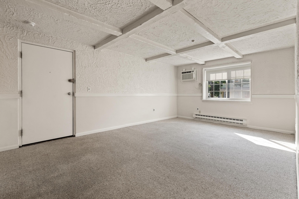 21 Central Street, Unit 26 Everett, MA 02149 - Photo 5 of 12 an empty room with windows