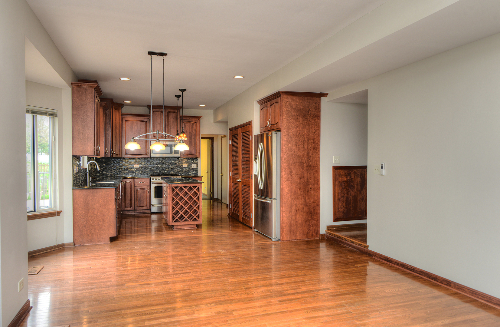 503 Yardley Drive Carol Stream, IL 60188 - Photo 11 of 41 an open kitchen with a refrigerator and a sink
