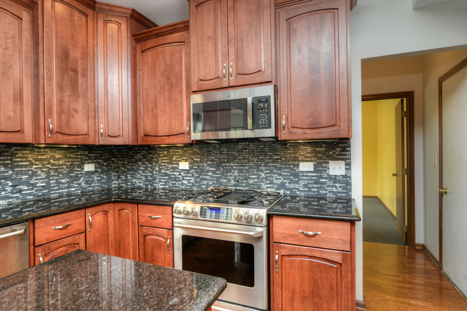 503 Yardley Drive Carol Stream, IL 60188 - Photo 15 of 41 a kitchen with stainless steel appliances granite countertop a stove a sink and a microwave