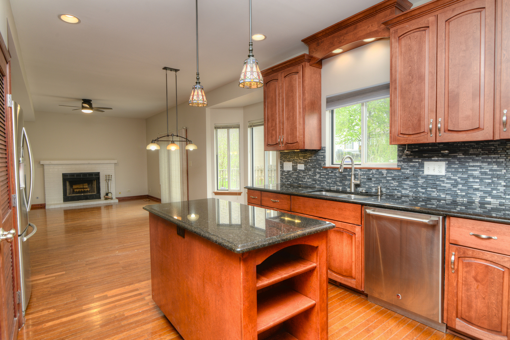 503 Yardley Drive Carol Stream, IL 60188 - Photo 16 of 41 a kitchen with stainless steel appliances granite countertop a sink a stove and a wooden floors