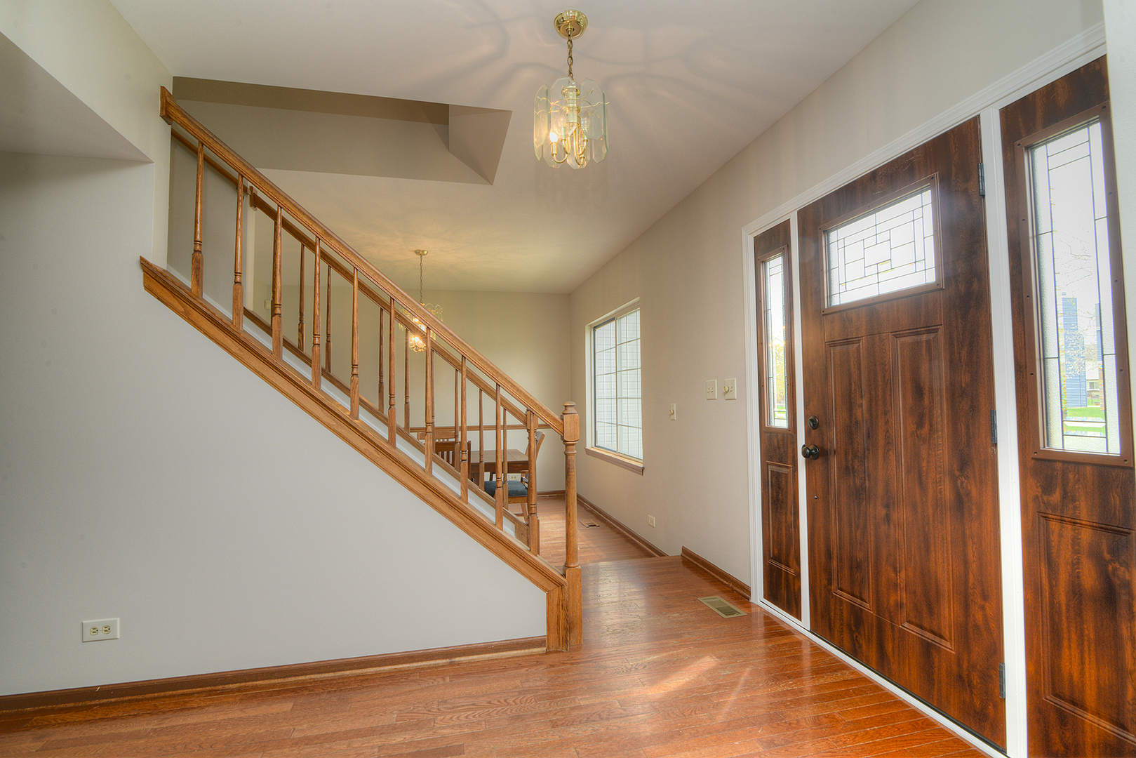 503 Yardley Drive Carol Stream, IL 60188 - Photo 3 of 41 a view of entryway and hall with wooden floor